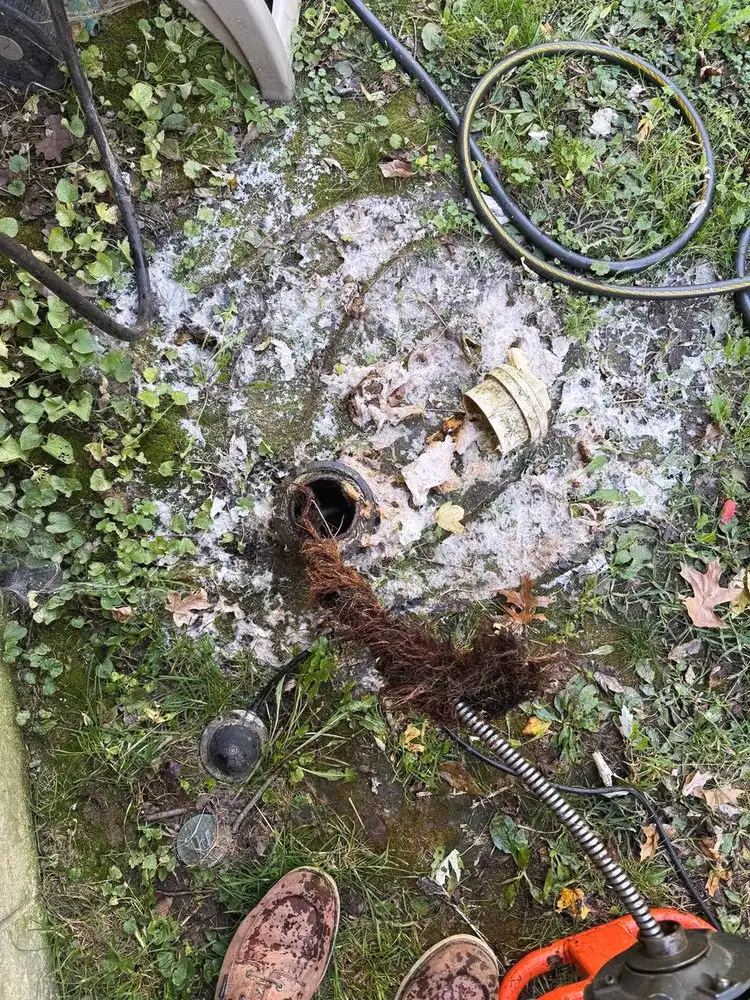 Sewer cleanout opened with the drain cable in it