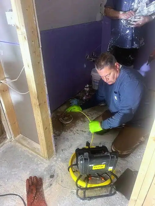 Joe running a sewer camera